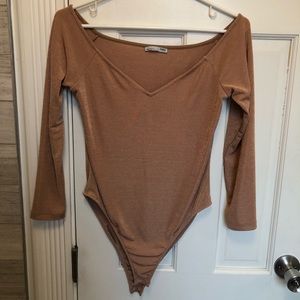 Long-sleeved body suit